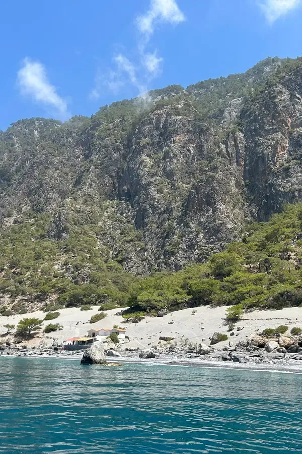 View of the calm turquoise waters and sandy beach at Agios Pavlos bay, Crete.