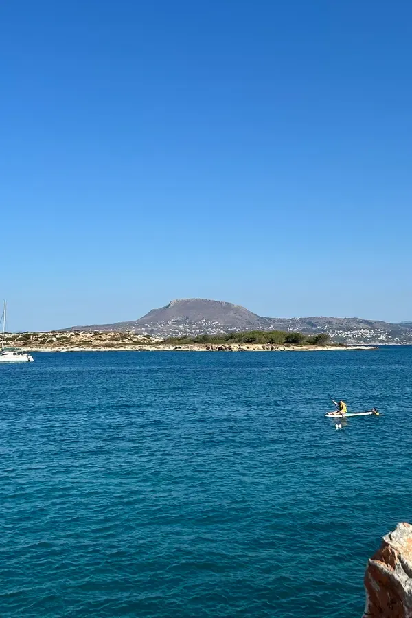 Coastal view showcasing the unique architecture and bright blue waters at Marathi, northern Crete