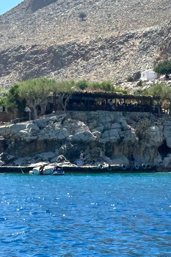 Crystal clear waters and lush green coastal headlands defining the natural beauty of Marmara on Crete.