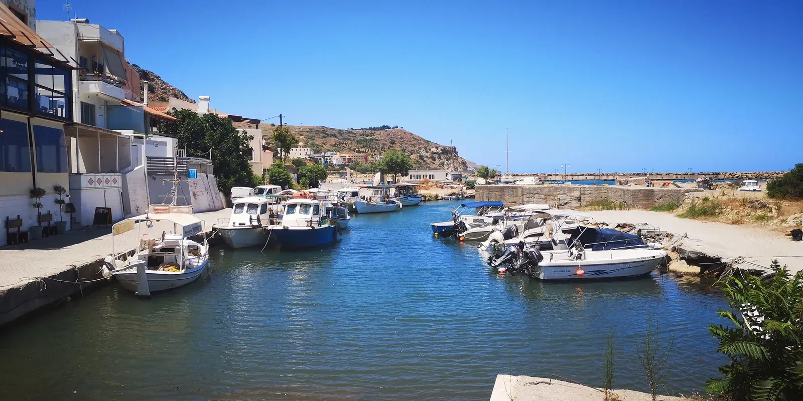 Kolimbari’s rugged coastline featuring dramatic cliffs meeting the deep blue waters of the Cretan sea.