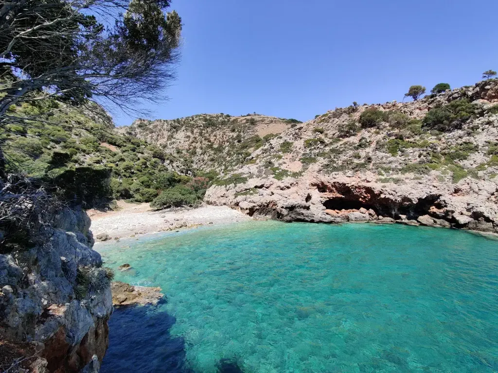 The stretch of fine white sand and crystal clear Aegean waters at Ramyas beach, Crete.