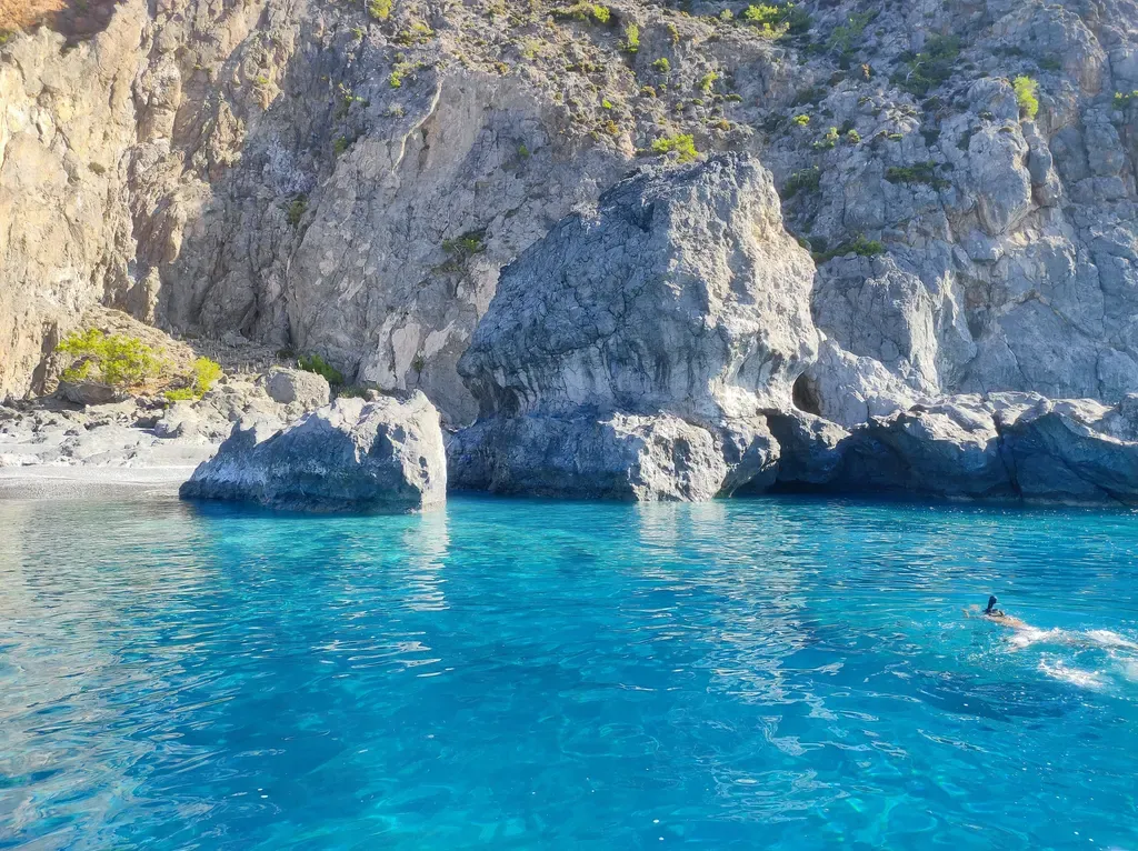 Mandrakia village houses and clear blue waters overlooking the southern coast of Crete.